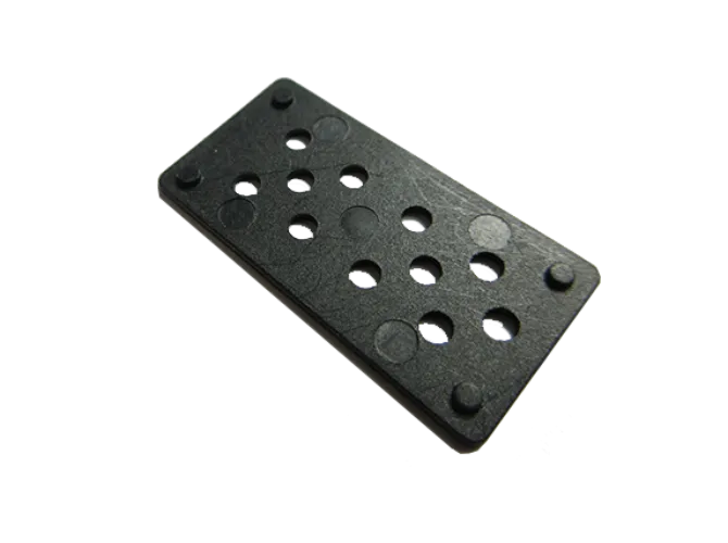 Black domino with sixteen holes